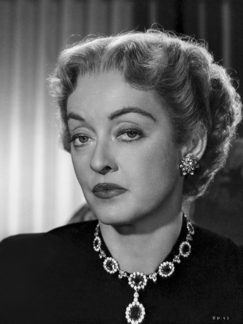 Bette Davis Portrait Looking Serious in Black Suit Dress and Black Gem Necklace with Middle parted Curls Photo Print - Item # VARCEL693411