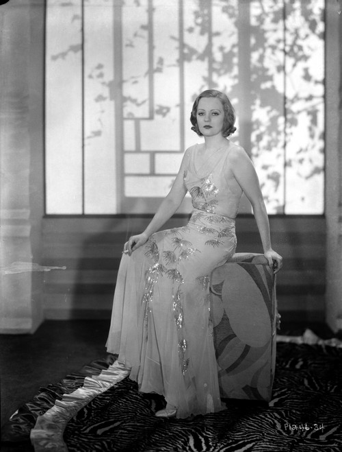 Talullah Bankhead sitting in Embroidered Dress Photo Print - Item # VARCEL693423