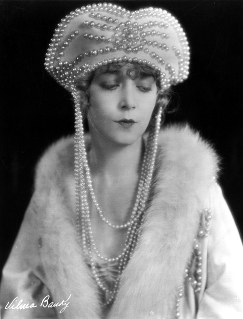 Vilma Banky on a Beaded Hat and Furry Shawl Photo Print - Item # VARCEL693467