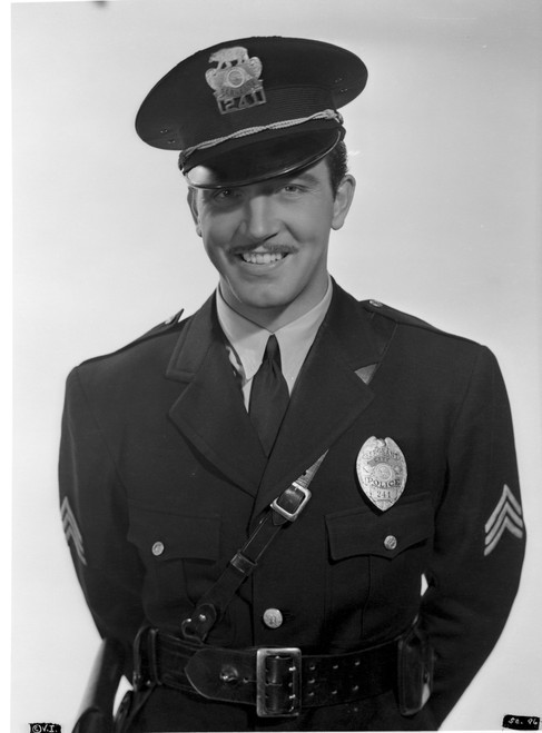 John Payne as a policeman Photo Print - Item # VARCEL693509
