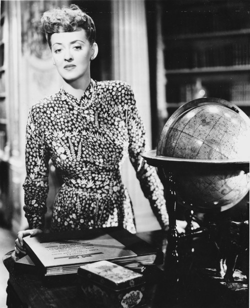 Bette Davis Posed Leaning on the Table in Black Polka Dot Long Sleeve Shirt and Pearl Necklace Photo Print - Item # VARCEL693600