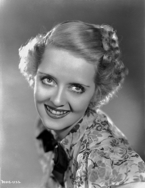 Bette Davis Portrait in Looking Up in Floral Dress with Top Knot and Short Curl Hair Photo Print - Item # VARCEL693590