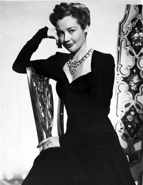 Lynn Bari on a Long Dress and sitting on Chair Photo Print - Item # VARCEL693629