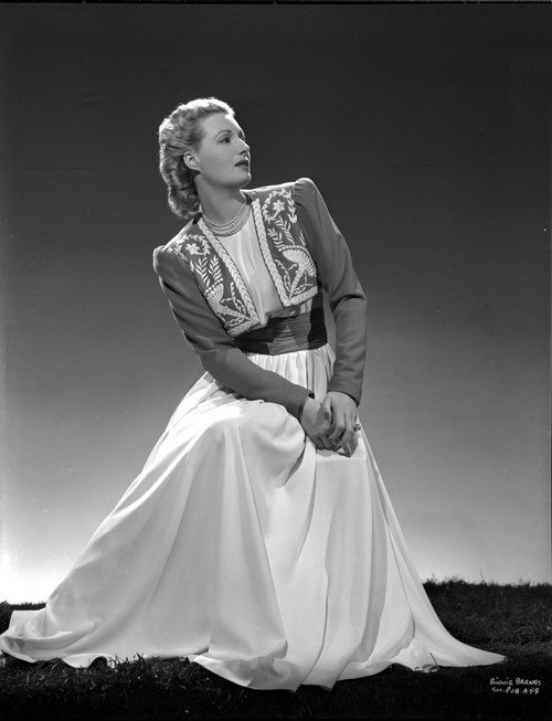 Binnie Barnes on a Dress sitting and Leaning Photo Print - Item # VARCEL693675