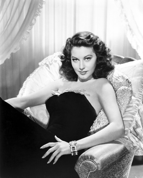 Ava Gardner Lying on a Couch wearing a Black Gown Photo Print - Item # VARCEL693678
