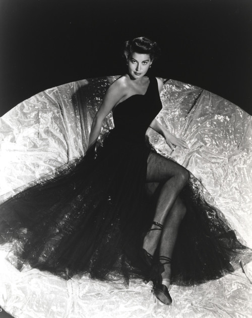 Ava Gardner posed in Long Black Gown with Stockings and Stiletto Photo Print - Item # VARCEL693756