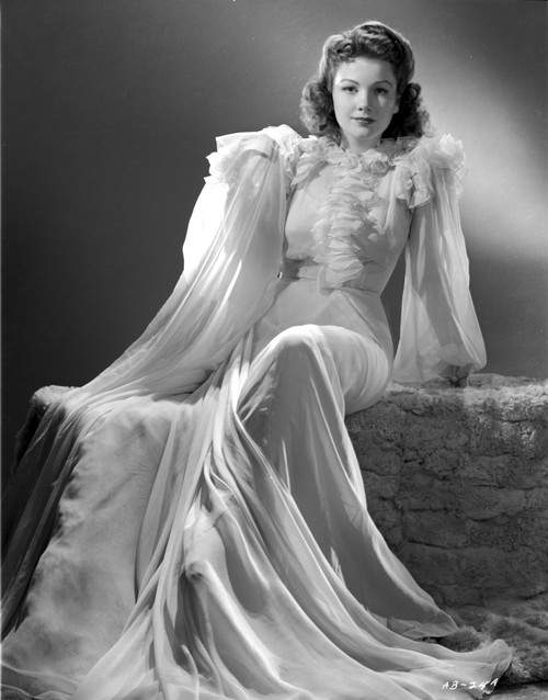 Anne Baxter on a Ruffled Dress smiling in Black and White Portrait Photo Print - Item # VARCEL693855
