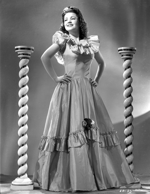 Anne Baxter on a Gown with Hands on the Waist Photo Print - Item # VARCEL693875