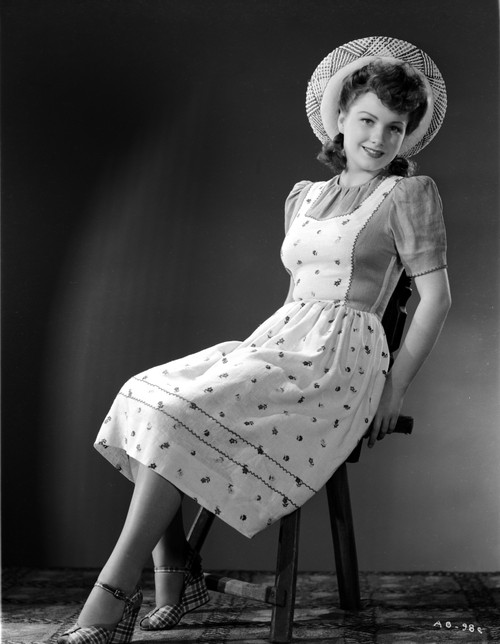 Anne Baxter on Printed Top sitting and smiling Photo Print - Item # VARCEL693896