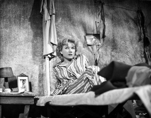 Anne Baxter on Printed Top sitting and Leaning on a Bed Photo Print - Item # VARCEL693915