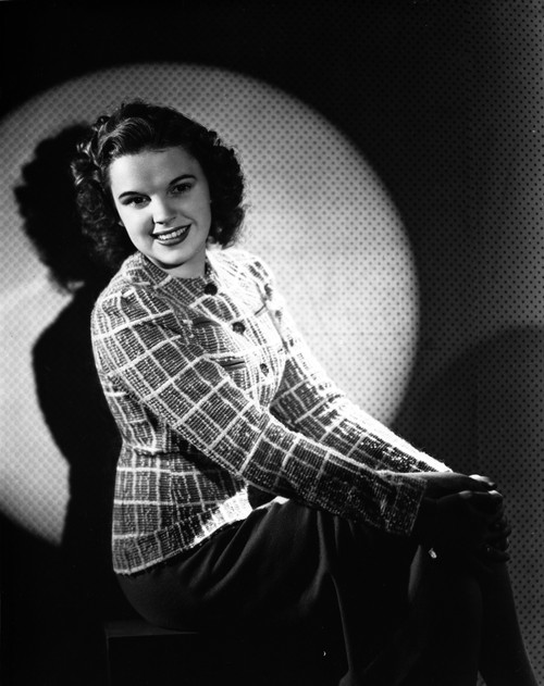Judy Garland sitting down portrait light on her +tograph High Qua Photo Print - Item # VARCEL693964