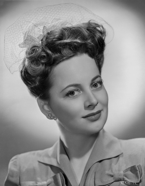 Olivia DeHavilland Portrait in Blouse with Earrings Photo Print - Item # VARCEL694265