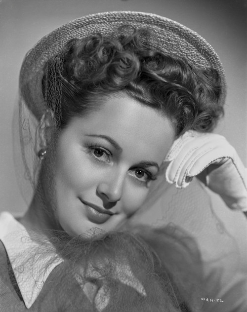 Olivia DeHavilland Portrait in Formal Top with Earrings and Gloves Photo Print - Item # VARCEL694273