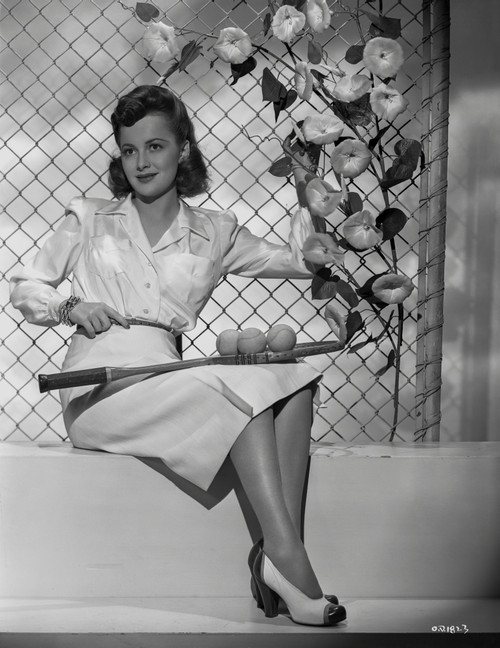 Olivia DeHavilland Seated in Classic with Heels Photo Print - Item # VARCEL694310