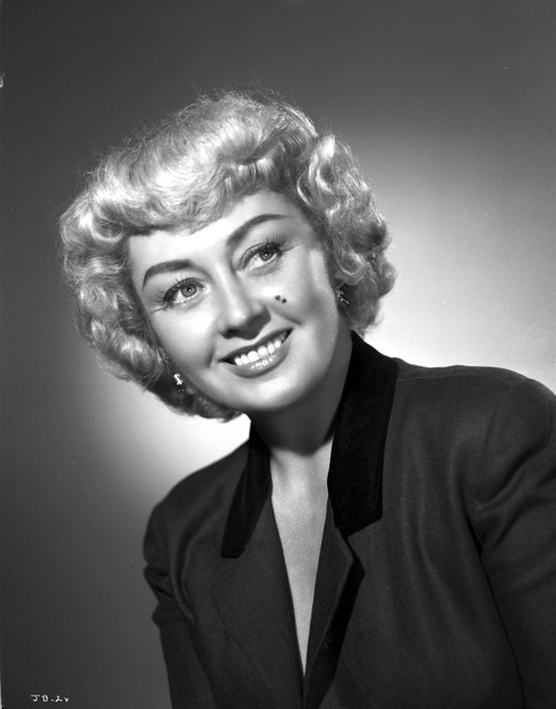 Joan Blondell on a Leaning and smiling Portrait Photo Print - Item # VARCEL694335