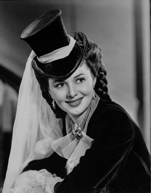Olivia DeHavilland Portrait in Blouse with Magician Hat Photo Print - Item # VARCEL694342
