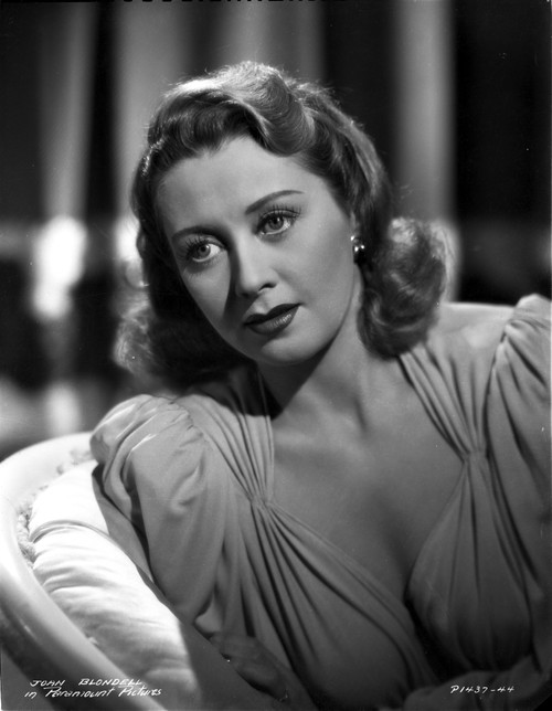 Joan Blondell Lying on the Couch in a Portrait Photo Print - Item # VARCEL694339