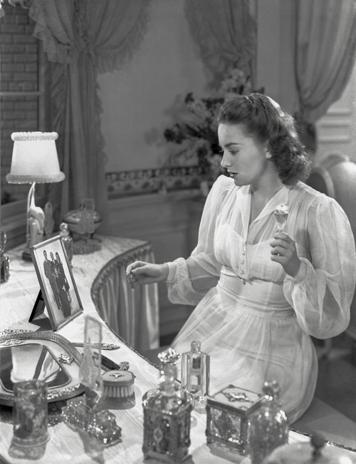 Olivia DeHavilland Seated in Silk Dress Photo Print - Item # VARCEL694361