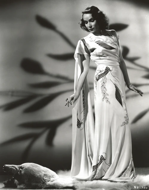 Dolores Del Rio standing in White Floral Dress Photo Print - Item # VARCEL694526
