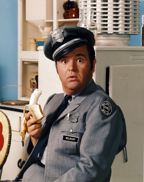 Dom Deluise in Police Uniform with Banana Photo Print - Item # VARCEL694654