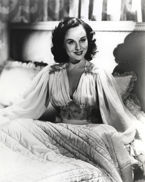 Paulette Goddard Seated in Bed wearing Elegant Dress Portrait Photo Print - Item # VARCEL694674