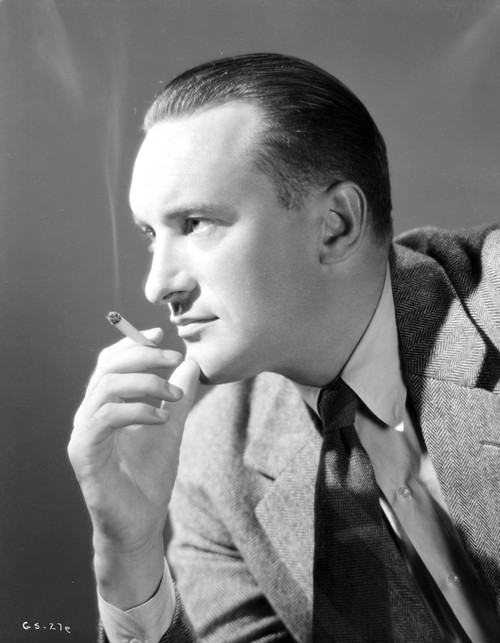A Portrait Of George Sanders Smoking A Cigarette Photo Print - Item # VARCEL694675