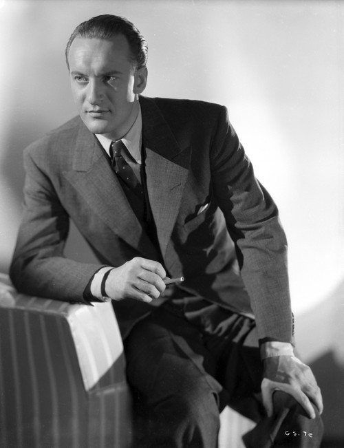 A Portrait Of George Sanders Smoking A Cigarette Photo Print - Item # VARCEL694683