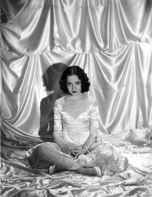 Mary Brian sitting in a White Shiny Dress in Photo Print - Item # VARCEL694778