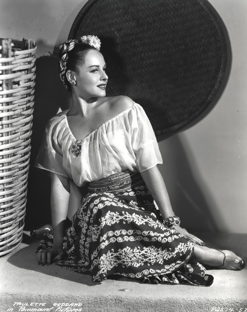 Paulette Goddard Seated and leaning wearing Blouse and Printed Skirt Portrait Photo Print - Item # VARCEL694844