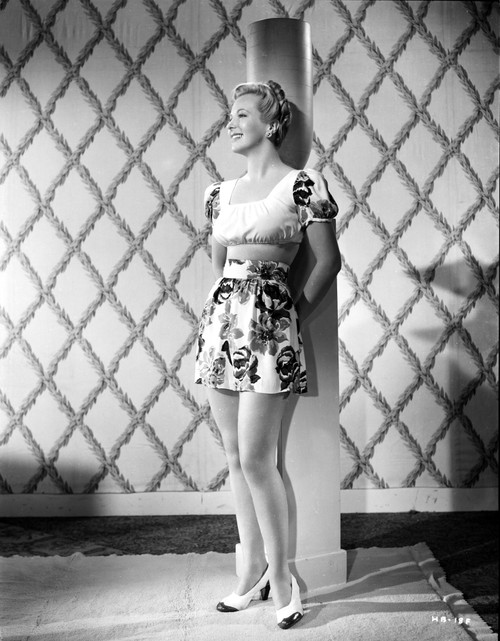 Hillary Brooks Leaning on Post in Printed Dress Photo Print - Item # VARCEL694899