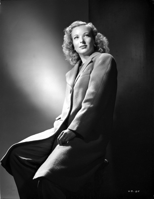Hillary Brooks sitting in Coat Photo Print - Item # VARCEL694903