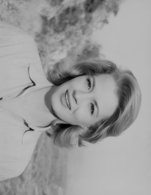 Angie Dickinson smiling and wearing White Polo in Classic Close Up Portrait Photo Print - Item # VARCEL695105