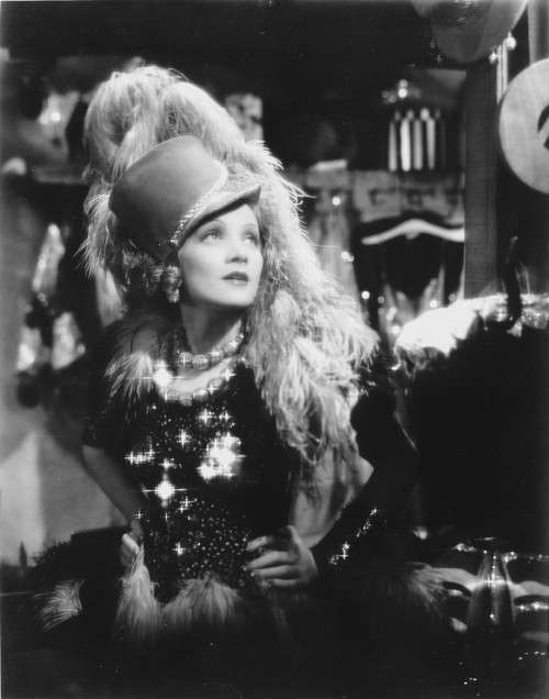 Marlene Dietrich Looking Side Ways in Black and White Dress with Feather Headdress Photo Print - Item # VARCEL695265