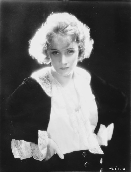 Marlene Dietrich Looking Serious in Black and White Dress with Black Background Photo Print - Item # VARCEL695269