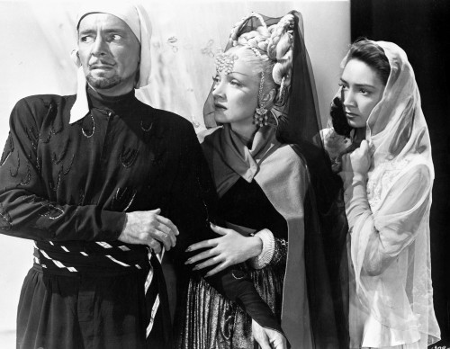 Marlene Dietrich with Two People Looking Away in Movie Scene Photo Print - Item # VARCEL695321