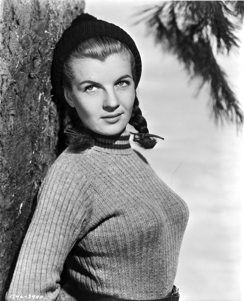 Corinne Calvet Leaning on Tree, wearing Sweater Photo Print - Item # VARCEL695326