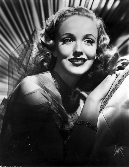 Georgia Carroll smiling with Red lipstick and Curly Hair Photo Print - Item # VARCEL695362