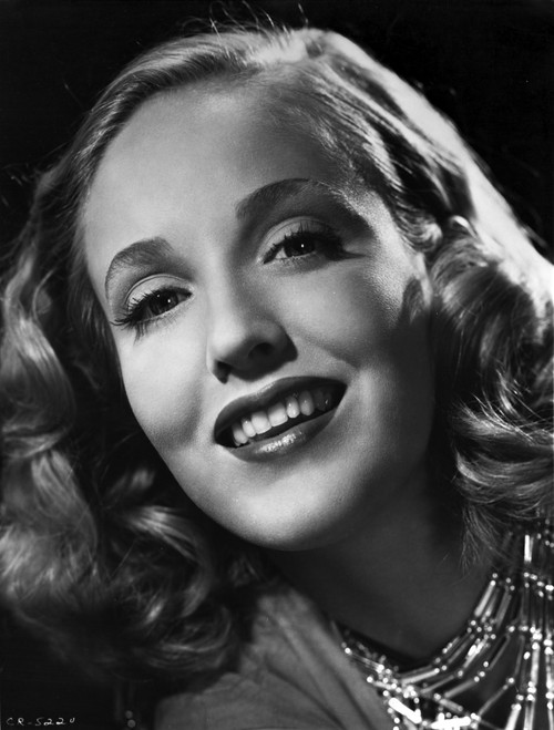 Georgia Carroll smiling with Red lipstick and Curly Hair Photo Print - Item # VARCEL695378