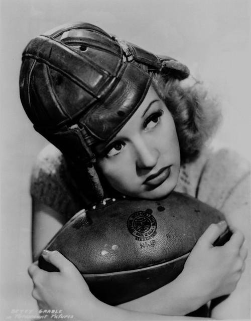 Betty Grable Posed with a Football Photo Print - Item # VARCEL695380