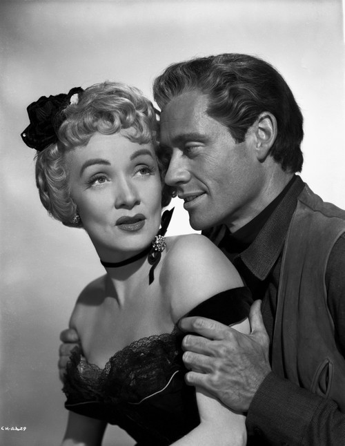 Marlene Dietrich Looking up in Strapless Dress with Man Holding Her Shoulder's Photo Print - Item # VARCEL695436