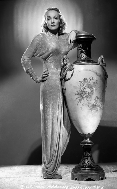 Marlene Dietrich standing in Classic Gown with Jar Photo Print - Item # VARCEL695465