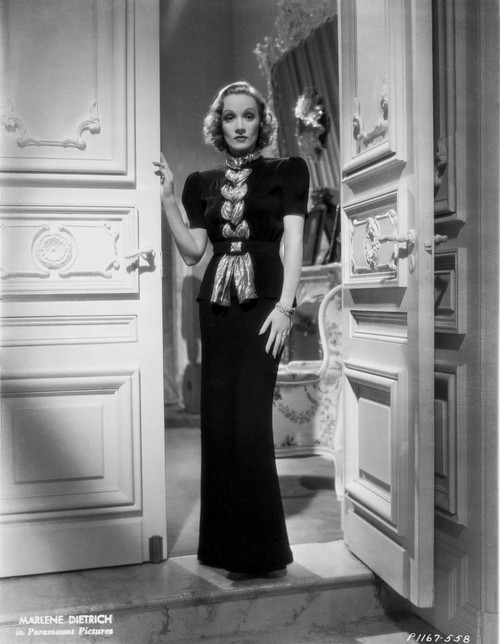 Marlene Dietrich standing in Black Dress with One Hand Holding to the Door Photo Print - Item # VARCEL695503