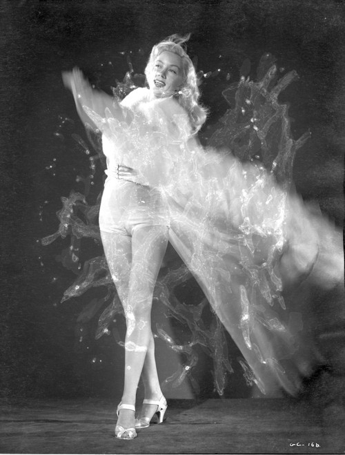 Gloria Grahame Waving Hand in a White Gown Photo Print - Item # VARCEL695640