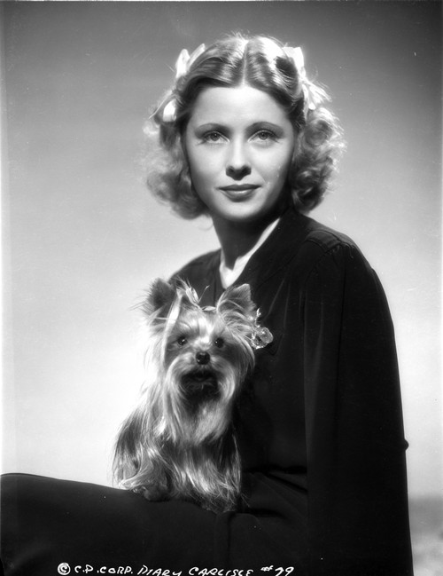 Mary Carlisle Portrait Holding a Dog Photo Print - Item # VARCEL695747