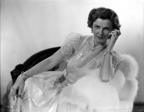 Irene Castle sitting and Leaning on a Couch in Gown Photo Print - Item # VARCEL695775