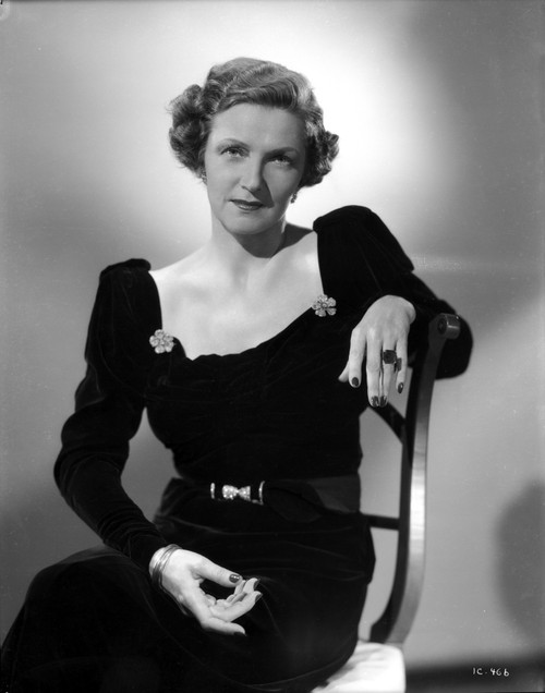 Irene Castle sitting and posed on Chair in Black Dress Photo Print - Item # VARCEL695799