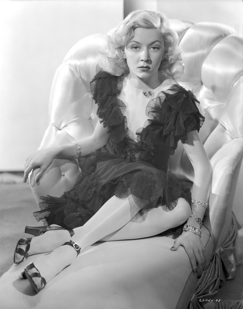 Gloria Grahame Posed on Couch wearing Black Dress Photo Print - Item # VARCEL695800