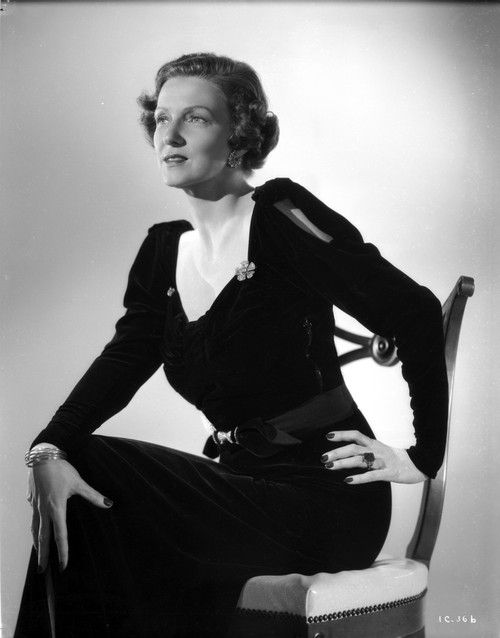 Irene Castle sitting on a Wooden Chair in Black Dress Photo Print - Item # VARCEL695791
