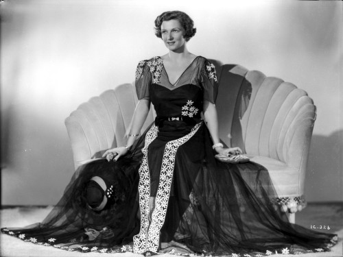 Irene Castle sitting on a Couch in Gown Photo Print - Item # VARCEL695817