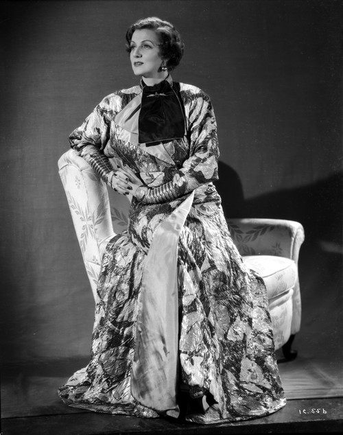 Irene Castle sitting on an Arm Rest in Printed Gown Photo Print - Item # VARCEL695870